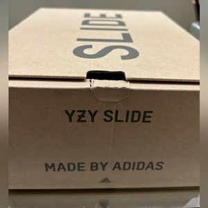 Brand new authentic addidas Yeezy slides. Never worn. Got as a gift